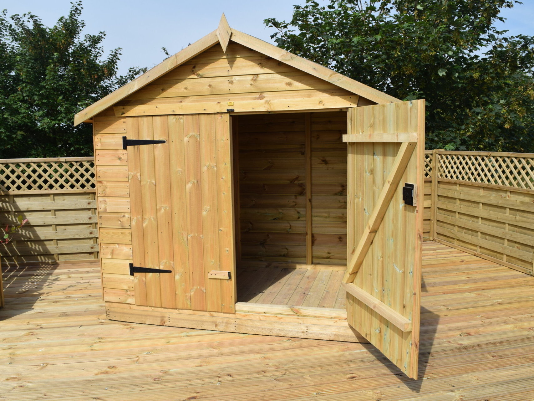 A brand new shed on decking in the garden