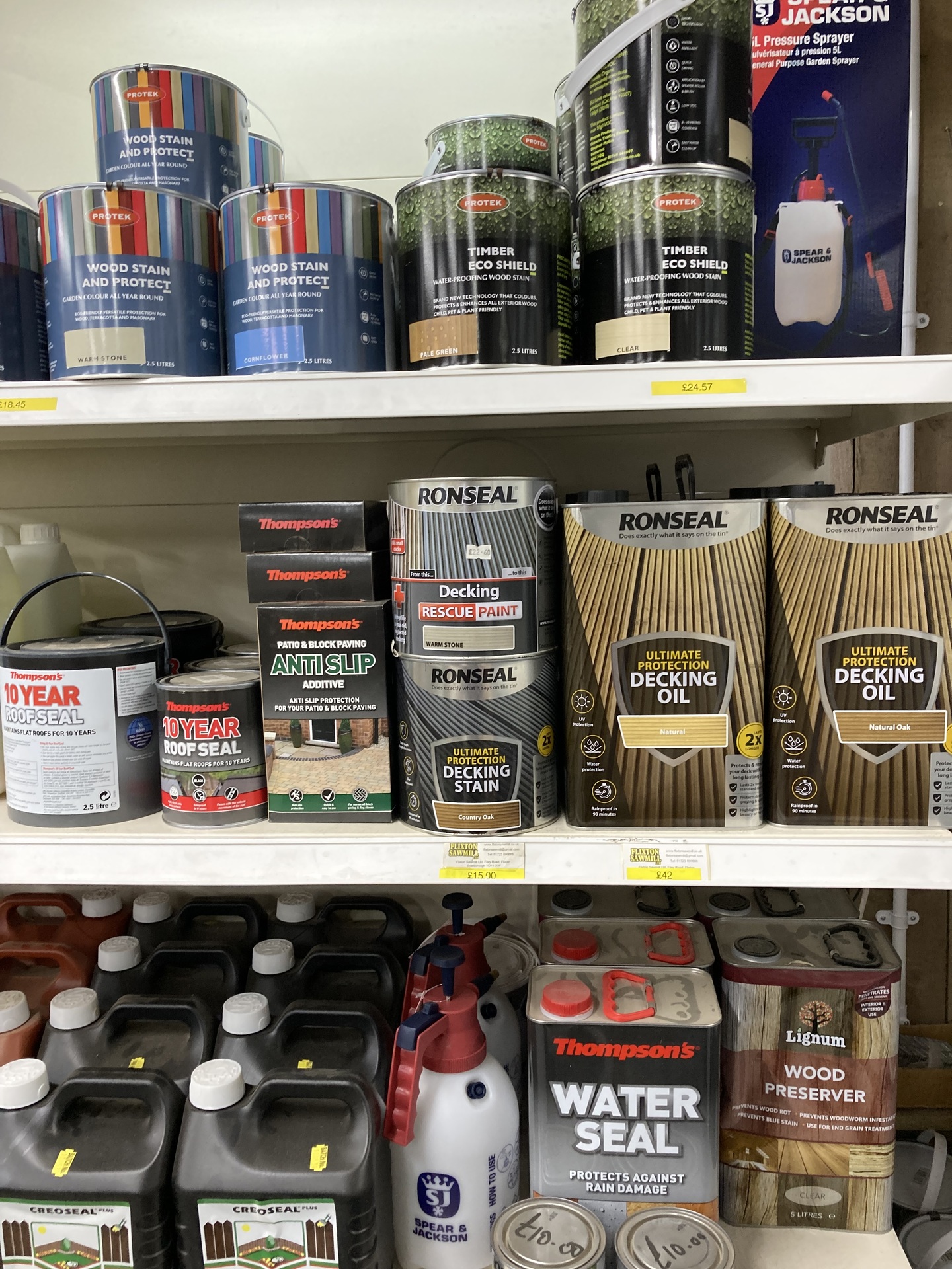 A shop's shelves with a stain protect and roof seal