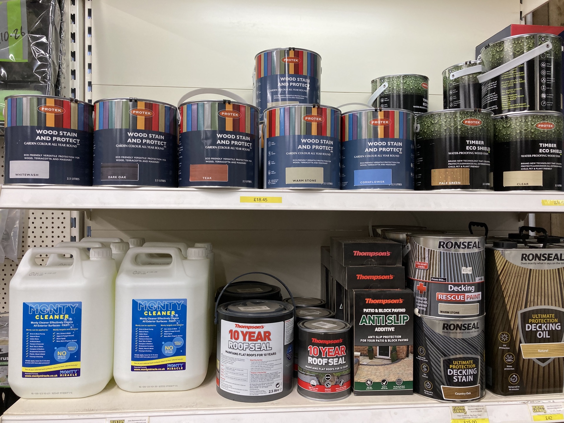 A store's shelves with roof seal, cleaner and wood stain