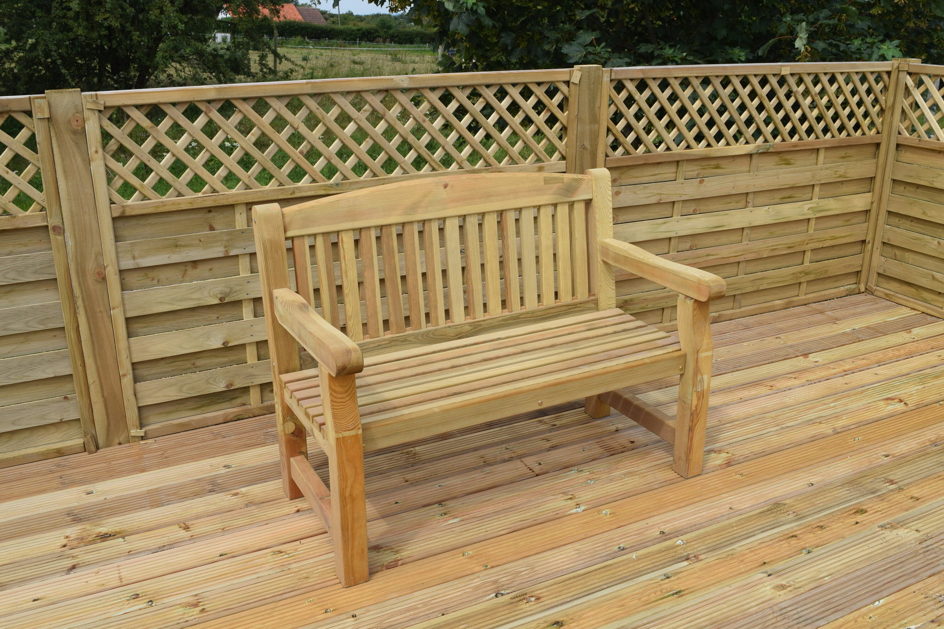 A wooden bench on a decking